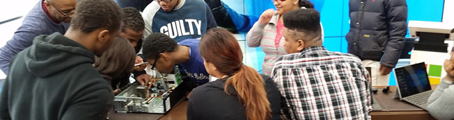 Techie Youth students dissecting a computer